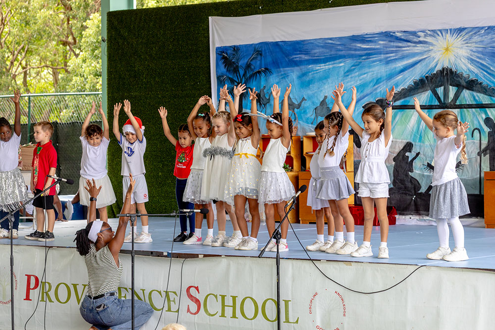 Christmas Assembly - 2025 - arms in the air