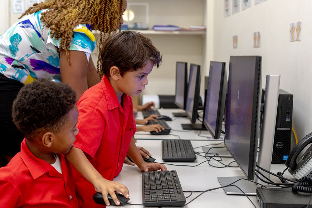 Young pupils working together on a computer