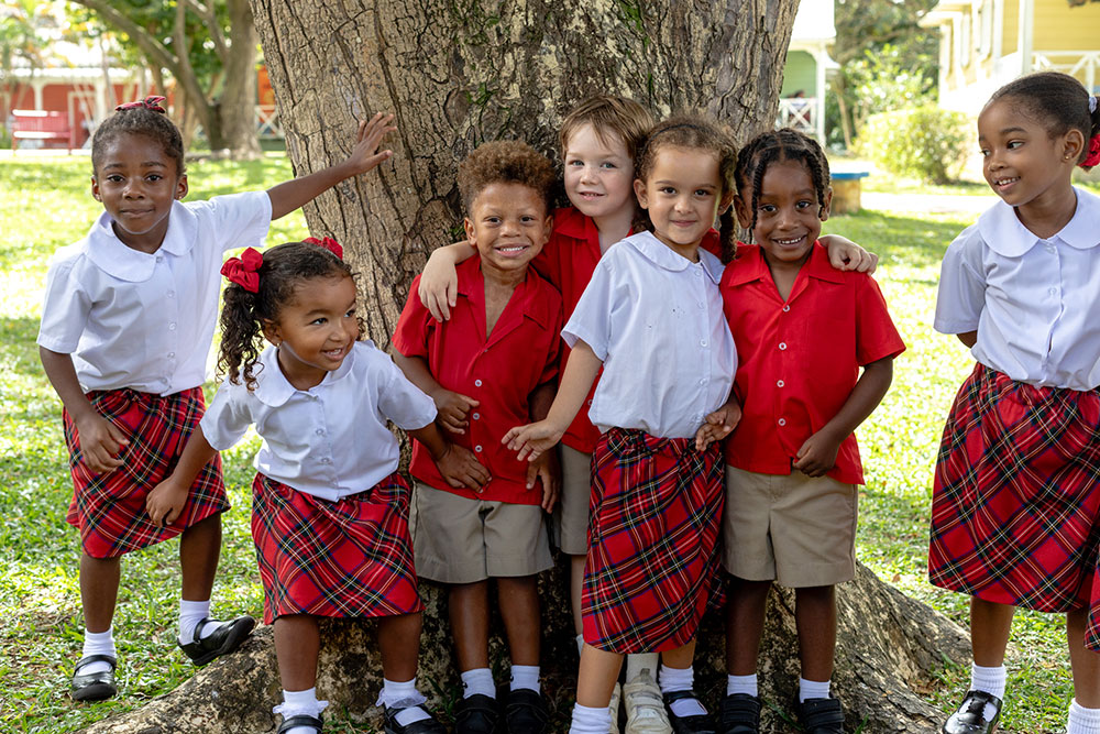 Group of infants under a tree
