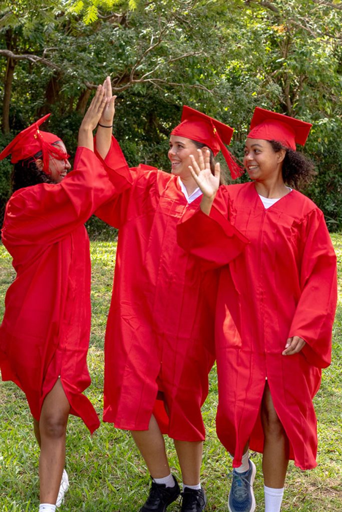 Graduation group high fiving